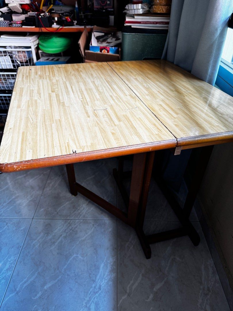 Foldable Table (Category: Tables & Sets) located in Singapore. Submitted by timtan8 (Listing ID 1351447532, Image 2). Description: height 70cm, 75 x 75cm when opened up as table. items on table not included. .