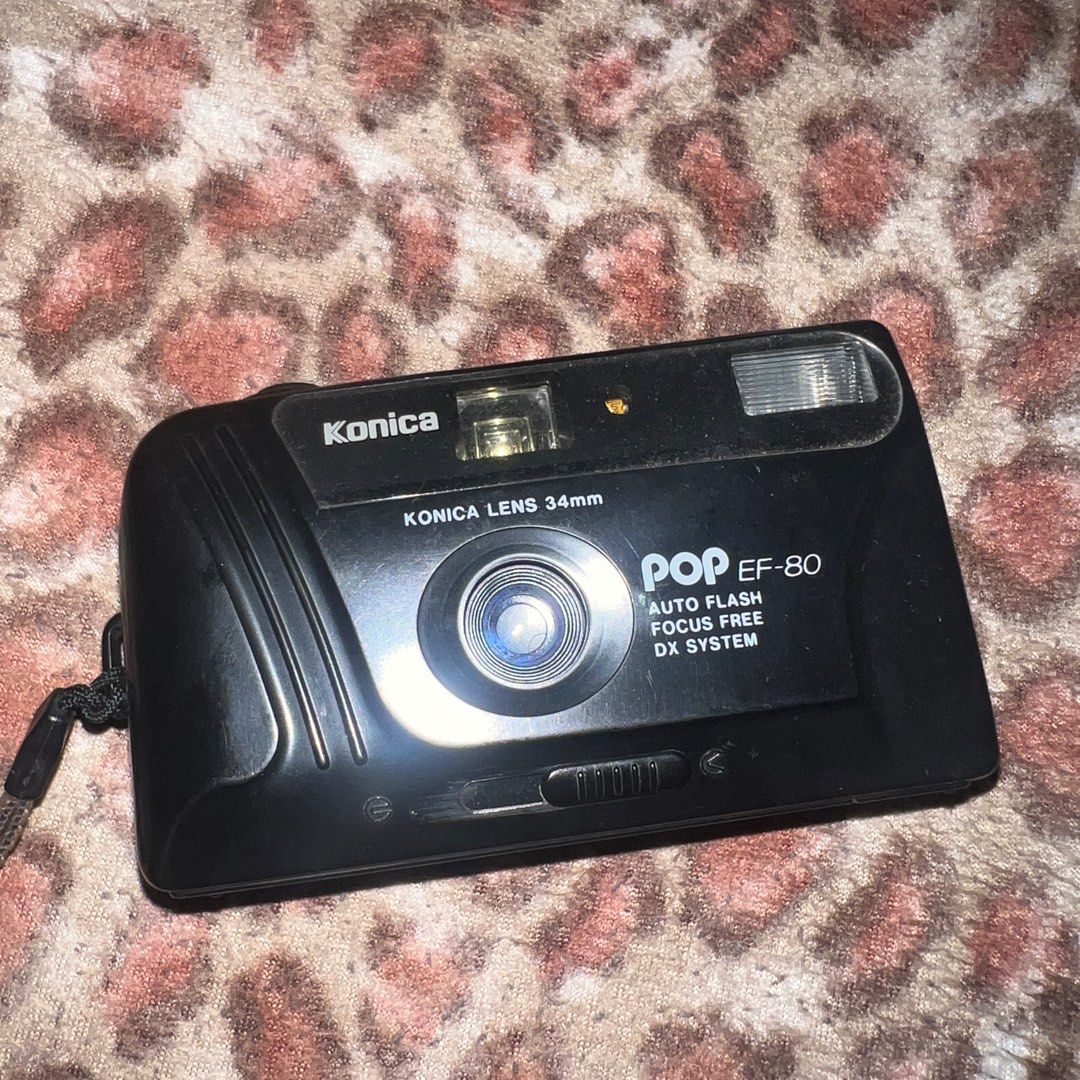 [ONHAND] Konica Pop EF-80 Film Camera (Category: Cameras) located in Marikina City. Submitted by periwinklepastel (Listing ID 1351431753, Image 2). Description: Sample photos posted are taken by me. Film used from sample photos is Kodak Colorplus 200 35mm No batteries included, but it uses AA batteries. Autoflash function No issues when I used it. All buttons working. Other details here: https://135compact.com/konica_pop_ef_80.htm https://www.lom