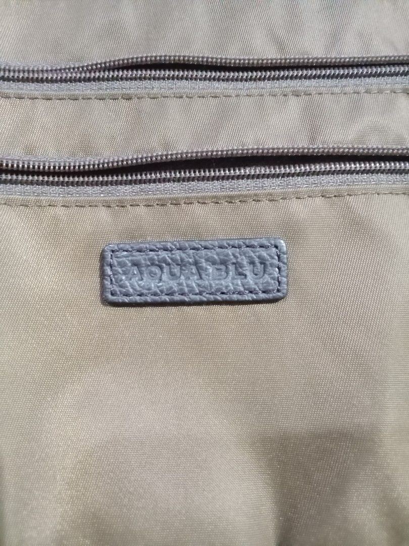 Original Aqua Blu bag (Category: Shoulder Bags) located in Lapu-Lapu City. Submitted by imight (Listing ID 1351567039, Image 3). Description: pasalubong from Japan color brown nylon and leather materials declutter new and never been used Strictly "NO RETURN, NO EXCHANGE" Policy!!! Gcash payment only J&T courier.