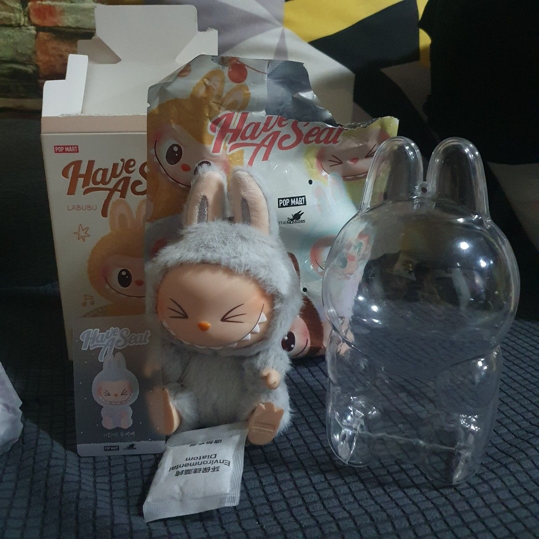 Popmart Labubu Have a Seat v2 Hehe (Category: Designer & Blind Box Toys) located in Caloocan City. Submitted by the_boxph (Listing ID 1351441796, Image 1). Description: For sale labubu Hehe 800 pesos with Acrylic Case last price posted Still comes with Box, Card and etc. Used only for display location: North Caloocan.