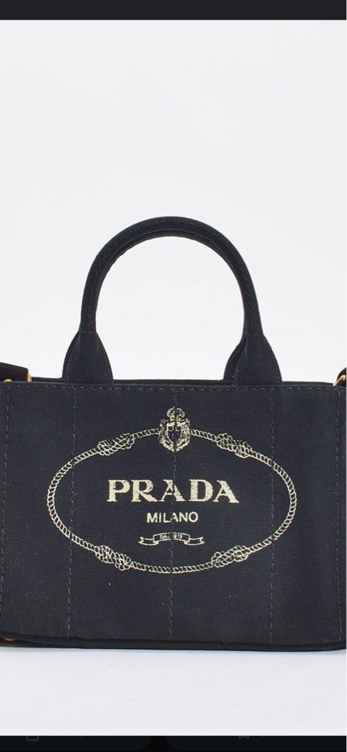 RUSH !!! Prada Canapa tote (Category: Luxury Bags & Wallets) located in San Juan City. Submitted by purselovebytin (Listing ID 1351456510, Image 1). Description: In very good condition!! Selling for a steal price!! Comes with cards and dust bag. Selling rush!! From 23,800 to 20,800!!.