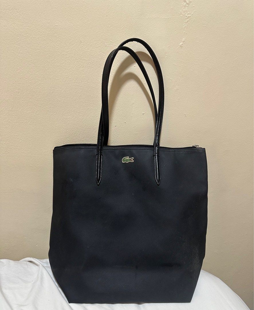 Authentic Lacoste Vertical Tote Bag (Category: Tote Bags) located in Dinalupihan. Submitted by sagideclutter (Listing ID 1351691165, Image 1). Description: Authentic Lacoste Vertical Lacoste Tote Srp 5950 Rfs: too many school bags Issue: small cracks on the handle but it's not too visible. .