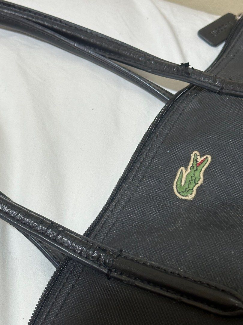 Authentic Lacoste Vertical Tote Bag (Category: Tote Bags) located in Dinalupihan. Submitted by sagideclutter (Listing ID 1351691165, Image 2). Description: Authentic Lacoste Vertical Lacoste Tote Srp 5950 Rfs: too many school bags Issue: small cracks on the handle but it's not too visible. .