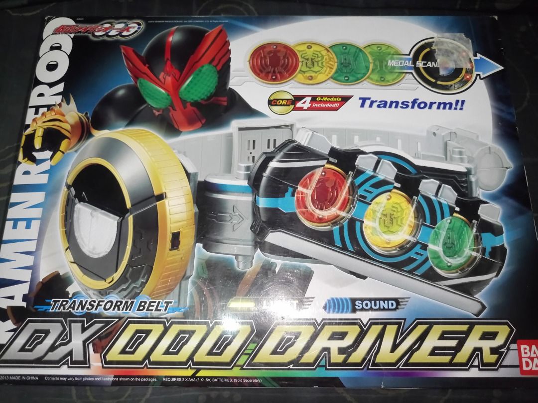 DX Kamen Rider 000 Driver ( Bandai Asia Relese version) (Category: Action & Battle Toys) located in Las Pinas. Submitted by dark_heaven_toy_and_comics (Listing ID 1351615303, Image 3). Description: a 2013 Bandai Asia release of the DX 000 Driver for the international market. This also coincide with the Hero taisen movie launch announcement . Identical to the japan 1st release but with better, louder Speaker sound than the japan release. Box still