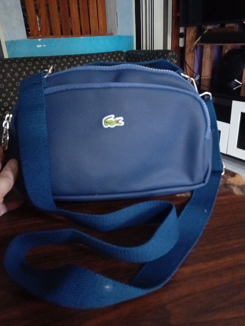 Lacoste Body/sling Bag (Category: Cross-body Bags) located in Valenzuela. Submitted by etzetera26 (Listing ID 1351663081, Image 1). Description: perfect for Body Bag and sling bag perfect size for daily use no issue.