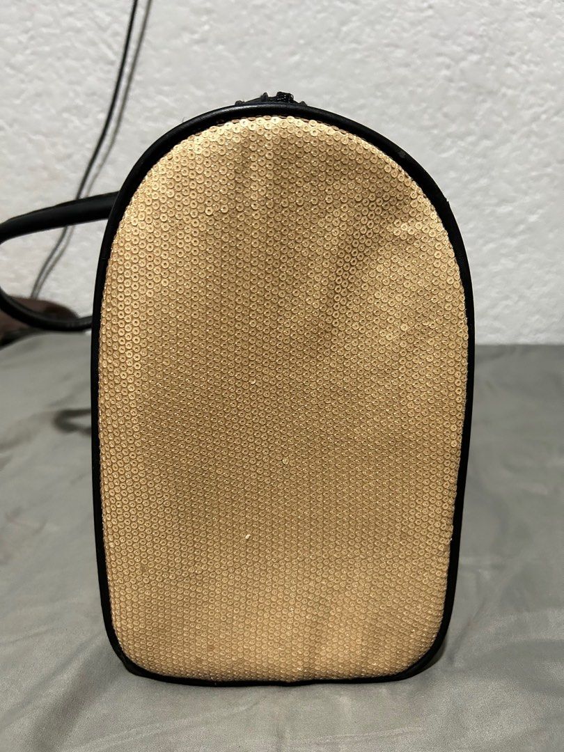 Mango Overnight Bag (Category: Luxury Bags & Wallets) located in Paranaque City. Submitted by maineacct (Listing ID 1351739070, Image 2). Description: With removeable base Gold sequinned bag Very good condition.