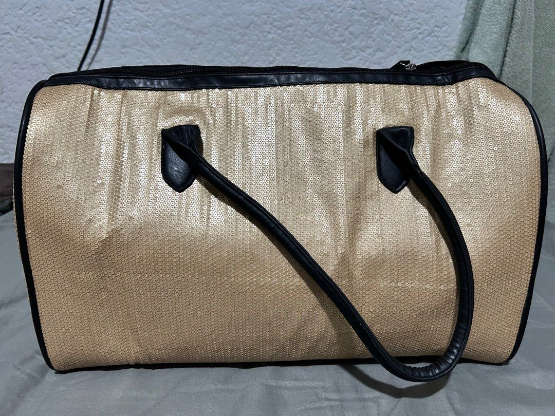 Mango Overnight Bag (Category: Luxury Bags & Wallets) located in Paranaque City. Submitted by maineacct (Listing ID 1351739070, Image 3). Description: With removeable base Gold sequinned bag Very good condition.