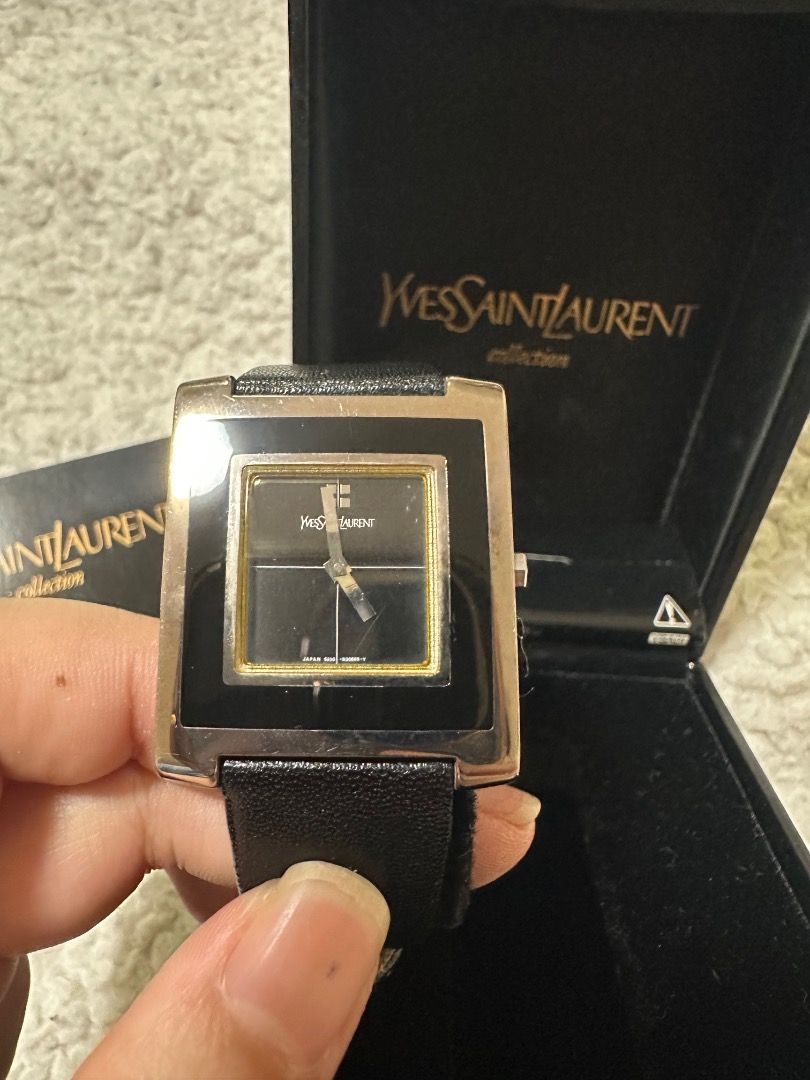 YSL Black Watch in Leather Strap with Box (Category: Luxury Watches) located in Manila. Submitted by skx09 (Listing ID 1351717151, Image 1). Description: Negotiable YSL Black Watch Case size: 30mmx32mm Dial: Black with 2 silver tone hands. Case: Plated base metal. Strap: Leather. Wristsize: Up to 18.7cm. Movement: Quartz (Japan). .
