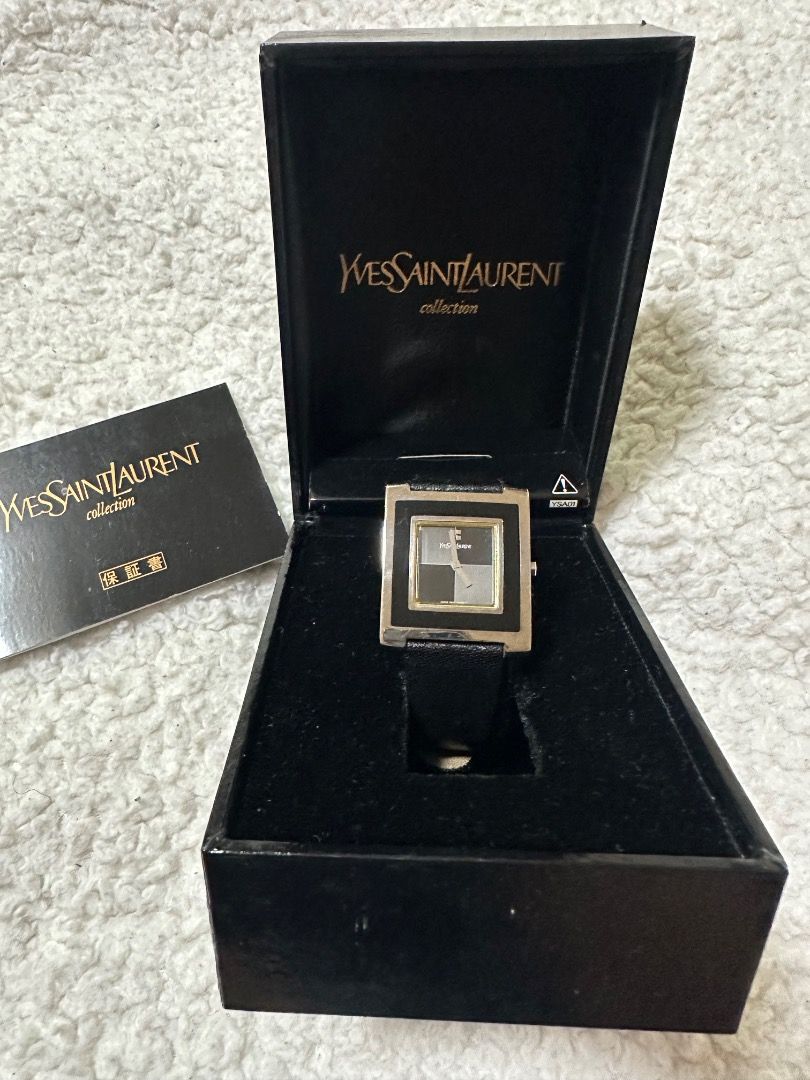 YSL Black Watch in Leather Strap with Box (Category: Luxury Watches) located in Manila. Submitted by skx09 (Listing ID 1351717151, Image 3). Description: Negotiable YSL Black Watch Case size: 30mmx32mm Dial: Black with 2 silver tone hands. Case: Plated base metal. Strap: Leather. Wristsize: Up to 18.7cm. Movement: Quartz (Japan). .