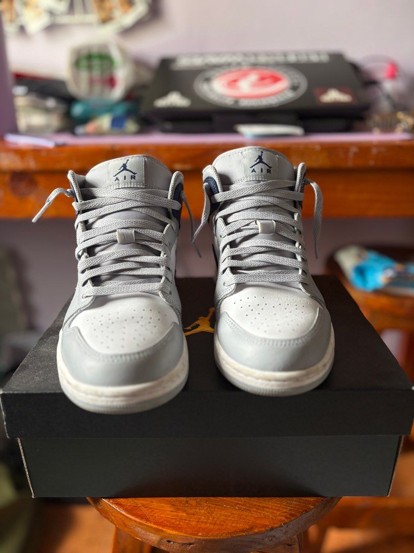 Air jordan 1 mid (light gray midnight navy) (Category: Sneakers) located in Cavite. Submitted by loon_a (Listing ID 1351798650, Image 2). Description: Air jordan 1 mid (light gray midnight navy) Size 9 No issues or flaws Actual photo posted MOP: GCASH MOD: J&T/same-day delivery.