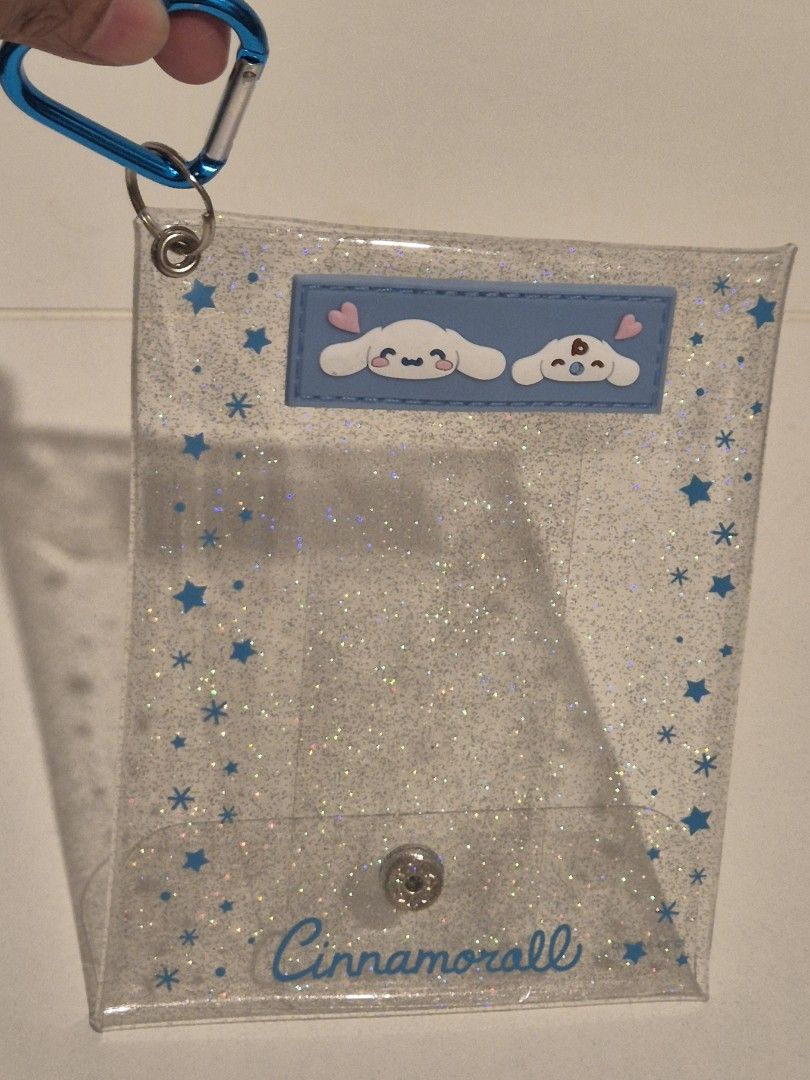 Cinnamoroll pouch keyring (Category: Character Goods) located in Makati City. Submitted by Vnerrie (Listing ID 1351808516, Image 3). Description: Cinnamoroll pouch keyring Glittery design on the PVC pouch - water resistant You can place your toy plush inside and hang on your bags..