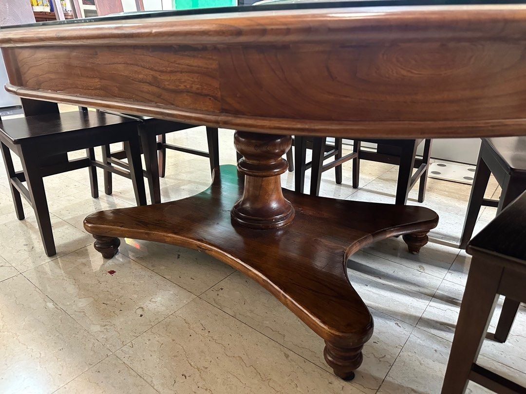 Solid Wood Dining Table (Category: Tables & Sets) located in Singapore. Submitted by goldencloud_5cb8f5 (Listing ID 1350867437, Image 2). Description: 1. Oval shaped solid teak dining table 2. 180cm (L) x 125cm (B) x 80 cm (H) 3. Tempered glass top 4. Lazy Susan 5. 6 solid wood chairs Arrange for own delivery .