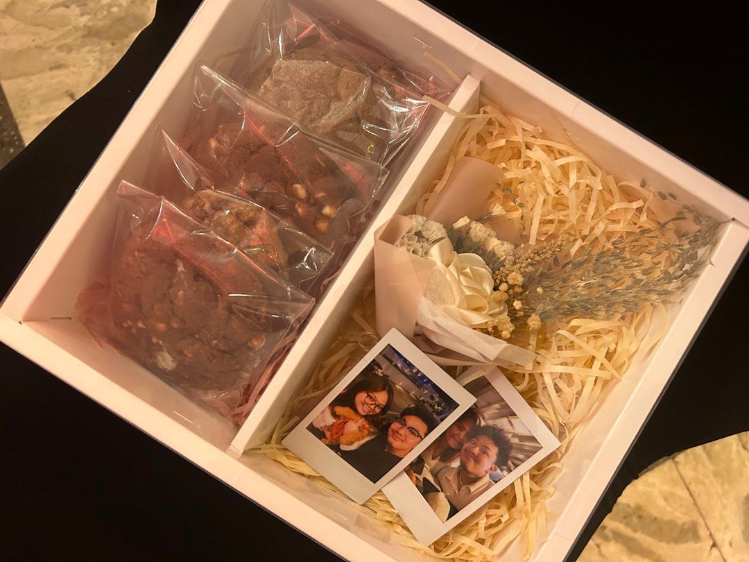Valentine's Gift Box Pre-Order (Category: Gift Baskets & Hampers) located in Las Pinas. Submitted by ladyattire (Listing ID 1351927681, Image 3). Description: Pre order now: Box of 5 cookies and mini satin rose bouquet + 2 instax photos Flavors: 2 red velvet cookies, 3 classic (chocolate chips) Send me a clear copy of your photos. 😉♥️ Palm Sized Cookies 🍪♥️ Medium Sized Box.