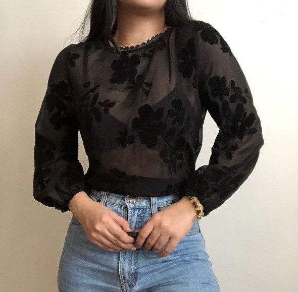 Black sheer floral longsleeves top (Category: Blouses) located in Makati City. Submitted by de_clutters (Listing ID 1351990008, Image 1). Description: Perfect for office girlies!! - in good condition - lighting may vary Model’s frame: medium Rfs: wfh na ako 😂.