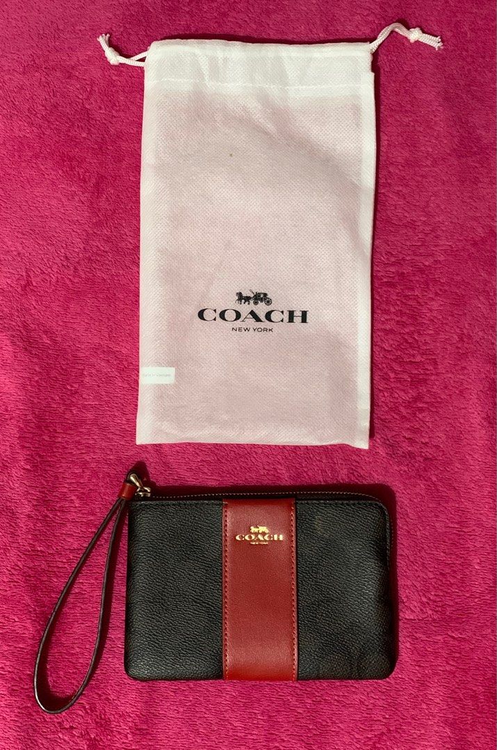Coach Corner Zip Wristlet (Category: Luxury Bags & Wallets) located in Bacoor. Submitted by raphaella28 (Listing ID 1352084817, Image 1). Description: Coach Corner Zip Wristlet in Signature Canvas Stripe Color: Gold/Walnut/Bold Red RFS: Bought another in a different color Purchased at: Hong Kong Condition: Never used .