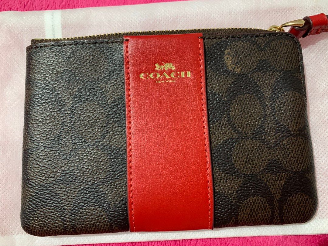 Coach Corner Zip Wristlet (Category: Luxury Bags & Wallets) located in Bacoor. Submitted by raphaella28 (Listing ID 1352084817, Image 2). Description: Coach Corner Zip Wristlet in Signature Canvas Stripe Color: Gold/Walnut/Bold Red RFS: Bought another in a different color Purchased at: Hong Kong Condition: Never used .