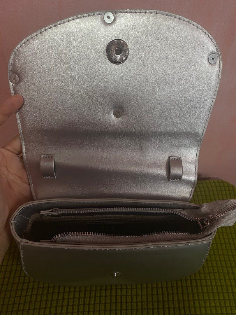 Diesel Silver Y2K Sling Bag (Category: Cross-body Bags) located in Bulacan. Submitted by clovdbusting (Listing ID 1352107534, Image 3). Description: Duped Diesel Silver Sling Bag Y2K Style Used only once Good condition .