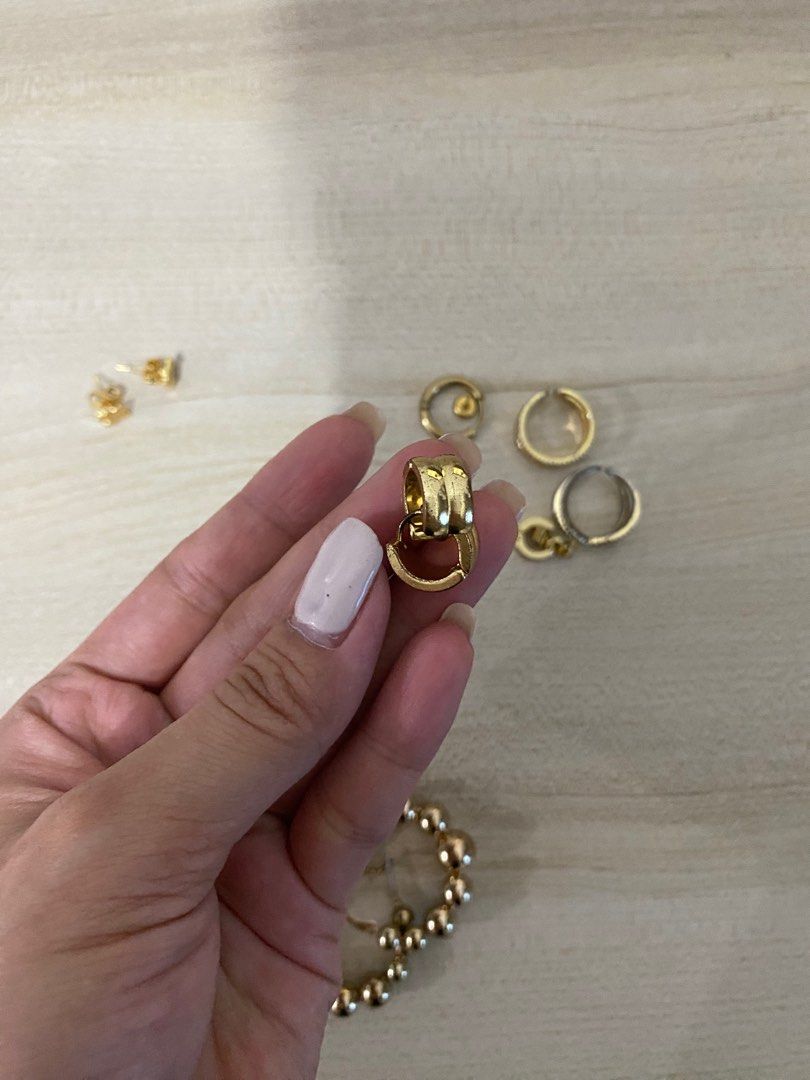Gold Jewelry Set: Earrings & Ring accessories (Category: Earrings) located in Quezon City. Submitted by segfcarts (Listing ID 1352091466, Image 3). Description: Set of gold accessories: 3 earrings & 1 ring. Hoop earrings, adjustable ring.