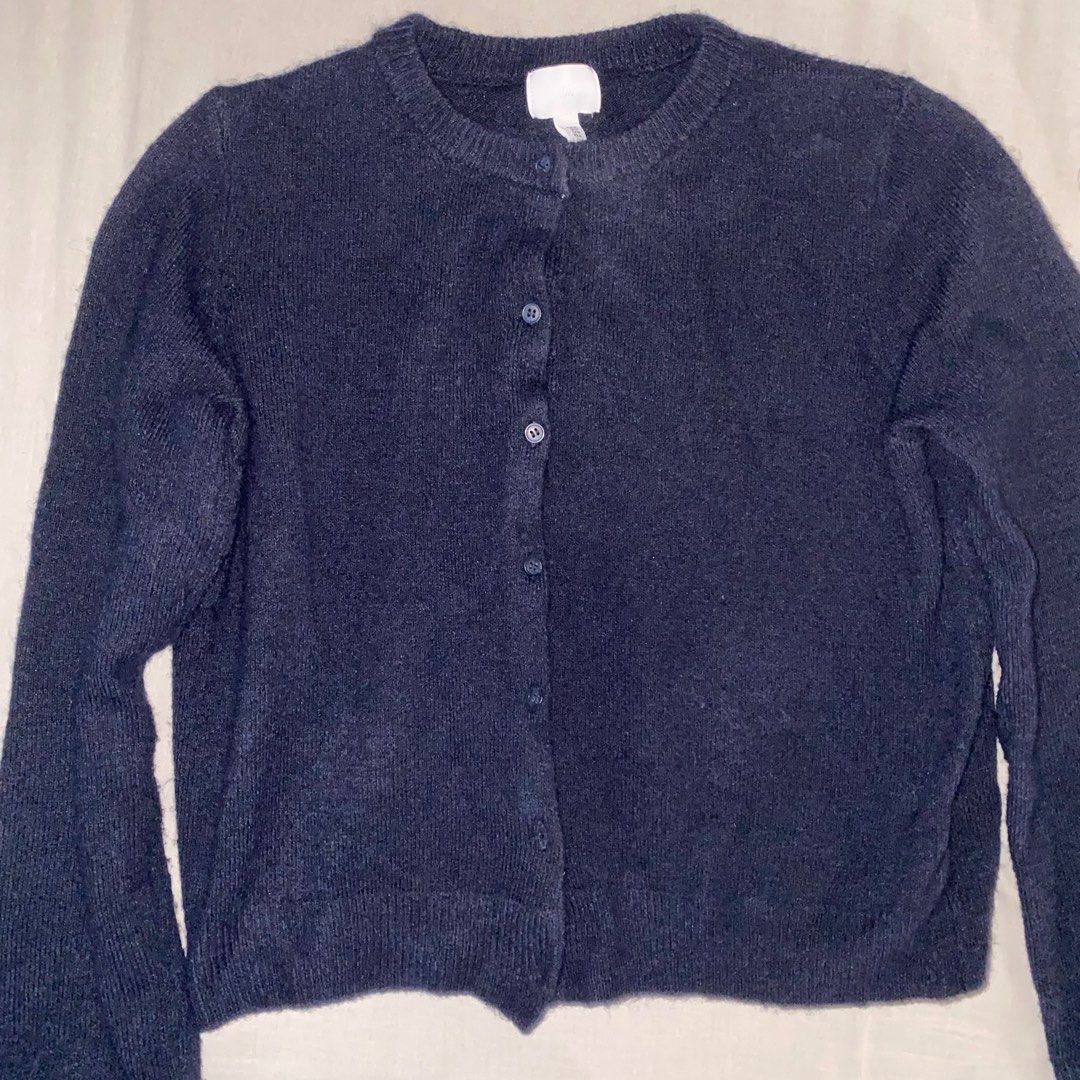 H&M Navy Blue Thick Cardigan (Category: Longsleeves) located in Las Pinas. Submitted by gaea.d (Listing ID 1352138578, Image 1). Description: Navy blue cardigan from H&M. Loose fit. Don't expect too much with the quality of the fabric since H&M cardigans are usually polyester, also why it feels a bit itchy. Still good though, but needs a wash and a lint roller.