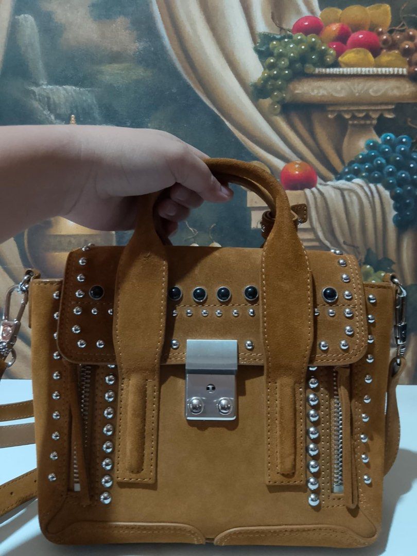 Philip Lim 3.1 Mini Pashli Satchel (Category: Luxury Bags & Wallets) located in Muntinlupa City. Submitted by phbudgetluxuryfinds (Listing ID 1233433441, Image 1). Description: You are buying an Authentic 100% Philip Lim bag. Excellent Condition. Dark Mustard color, suede leather. Size: Base length: 8.50 in Height: 7.50 in Width: 3.00 in Drop: 2.25 in Drop: 18.50 in Comes With Strap Luggage loop (dust bag original).