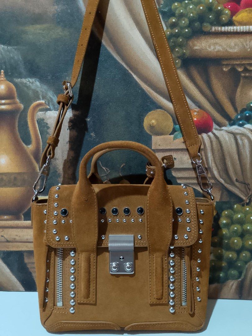 Philip Lim 3.1 Mini Pashli Satchel (Category: Luxury Bags & Wallets) located in Muntinlupa City. Submitted by phbudgetluxuryfinds (Listing ID 1233433441, Image 2). Description: You are buying an Authentic 100% Philip Lim bag. Excellent Condition. Dark Mustard color, suede leather. Size: Base length: 8.50 in Height: 7.50 in Width: 3.00 in Drop: 2.25 in Drop: 18.50 in Comes With Strap Luggage loop (dust bag original).