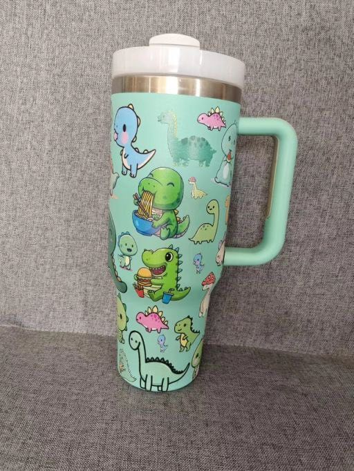 [SG Local Design] Dino Stanley Tumbler 2025. Dinosaur tumble design. Cute Dino pictures. (Category: Water Bottles & Tumblers) located in Singapore. Submitted by dominic.pereira. (Listing ID 1352029459, Image 2). Description: [SG Local Design] Dino Stanley Tumbler 2025. Dinosaur tumble design. Cute Dino pictures. https://sg.shp.ee/5p1usTy .