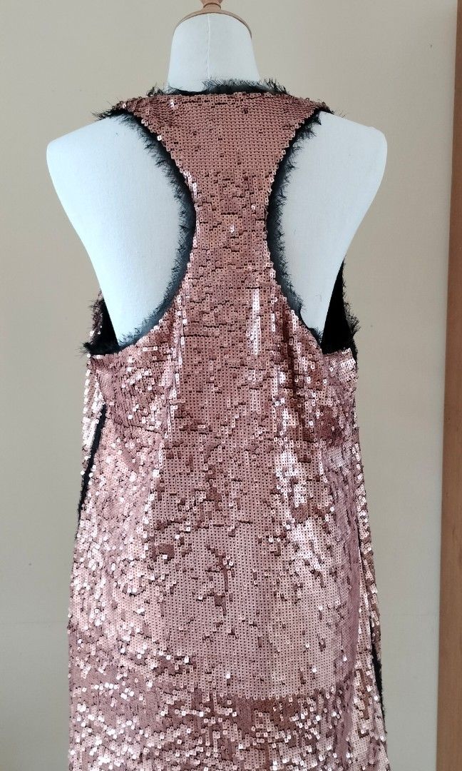 Sparkly Rachel Roy cocktail dress (Category: Dresses) located in Quezon City. Submitted by iciafvf (Listing ID 1352012149, Image 3). Description: Sparkly and frayed hems by Rachel Roy. Fully-lined. Copper or old rose color. Like new and in fine condition. Measurements: Bust: 46cm Length: 85cm MOP: Gcash or bank transfer SF c/o buyer kindly, direct message for additional details and pictures..