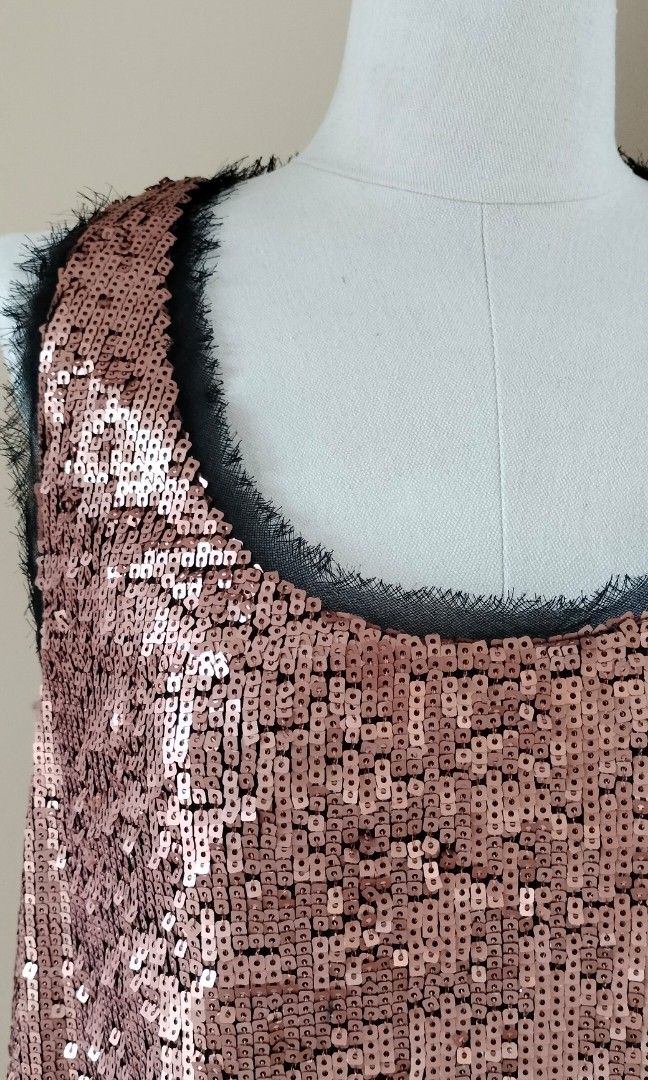Sparkly Rachel Roy cocktail dress (Category: Dresses) located in Quezon City. Submitted by iciafvf (Listing ID 1352012149, Image 2). Description: Sparkly and frayed hems by Rachel Roy. Fully-lined. Copper or old rose color. Like new and in fine condition. Measurements: Bust: 46cm Length: 85cm MOP: Gcash or bank transfer SF c/o buyer kindly, direct message for additional details and pictures..