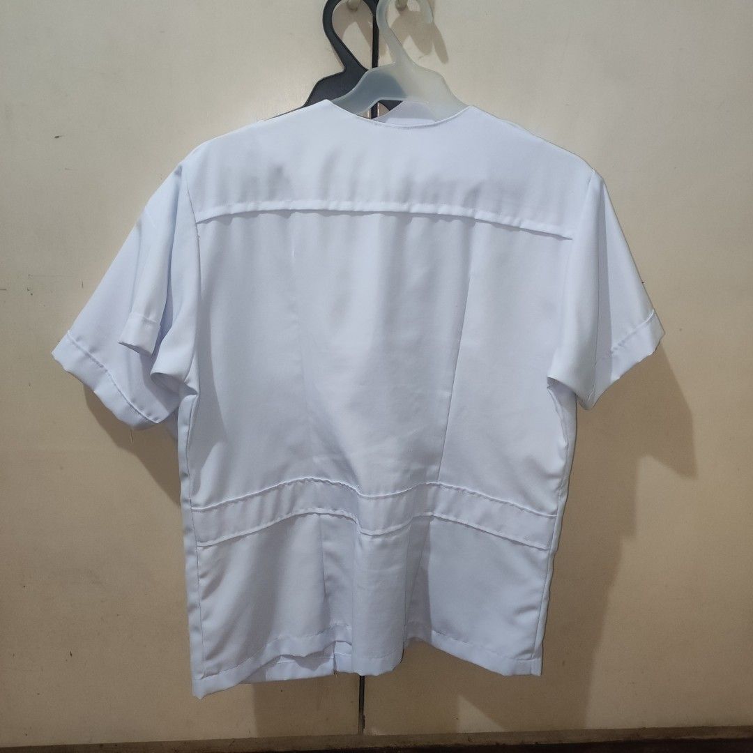 White medical course uniform (round neck) (set) (Category: Formal Shirts) located in Quezon City. Submitted by chaengramjl (Listing ID 1352115388, Image 2). Description: - white - rounded neck - left sided buttons length: 64 width: 41 stock: 2 mop: gcash, cimb, seabank mod: sdd, jnt loc: qc.