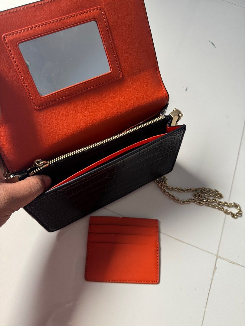 Charles & Keith Black Bag (Category: Clutches) located in Davao. Submitted by Chelly (Listing ID 1355651987, Image 2). Description: ✨Slightly used ✨With Dust Bag ✨Nakatago na lang kaya may slight pag balat sa loob bg bag (as seen on the photos) .