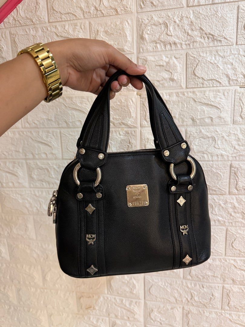 MCM Small Handbag Genuine Leather (Category: Luxury Bags & Wallets) located in Davao. Submitted by stellietas (Listing ID 1355639463, Image 2). Description: Size: Excelent condition, no flaws. Genuine Leather Small Black Silver tone hardware Clean interior.