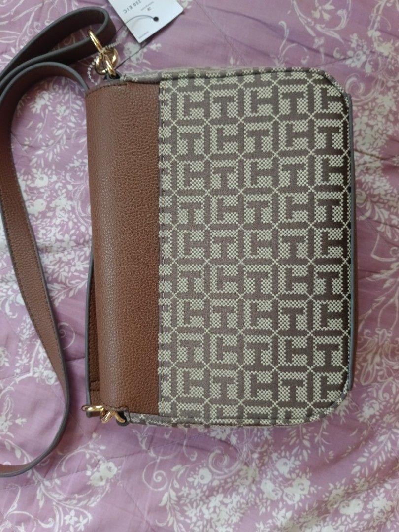 [Original] Tommy Hilfiger Crossbody Bag (Category: Cross-body Bags) located in Davao. Submitted by staceysvv (Listing ID 1355684483, Image 3). Description: — Brand New Tommy Hilfiger Crossbody — Never Used — Directly bought from US, originally bought for 108 USD and went on sale so that's why I'm pricing it lower — RFS: Impulsive buying — Can do meet-ups sa Davao or Tagum area only — Can do delivery but sf shouldered by buyer.