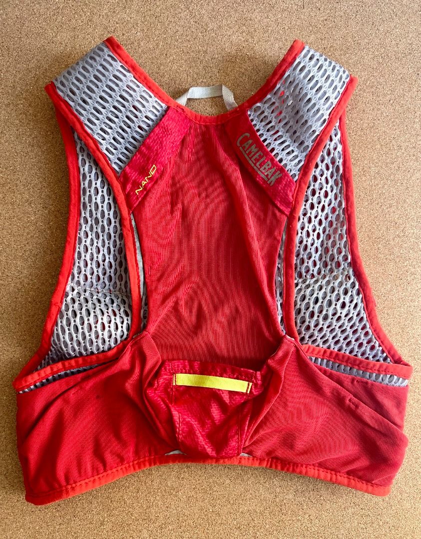 CAMELBAK Nano - Running Vest 17oz (Category: Hiking & Camping) located in Taguig. Submitted by LessThan (Listing ID 1357427856, Image 2). Description: CamelBak Nano Vest 17 oz Quick Stow Flask Hydration Pack x2 Crimson Red/Lime Punch Medium --- Been used in trail running session. Good condition and still no damages sa tela/accessories/buckles With 2 hydroflask, but lost cover sa suction nozzle. Decluttering/consolidating my personal belongings. N