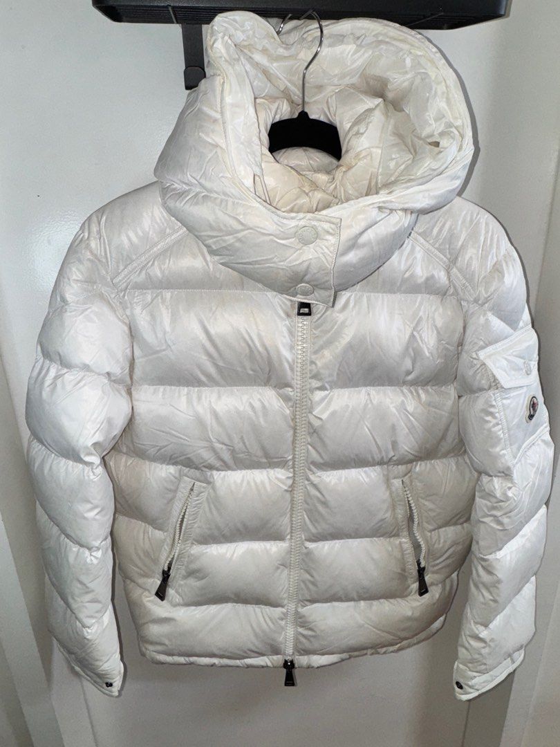 Moncler 90% Goose Womens (Category: Coats, Jackets and Outerwear) located in Taguig. Submitted by aa_decluttering (Listing ID 1357566476, Image 1). Description: Moncler Marie Guibotto Down Jacket 90% Goose Feather Removable hood Two-way zipper 2 zipper pockets Color: White Womens Size: 00 but fits upto medium With store reciept .