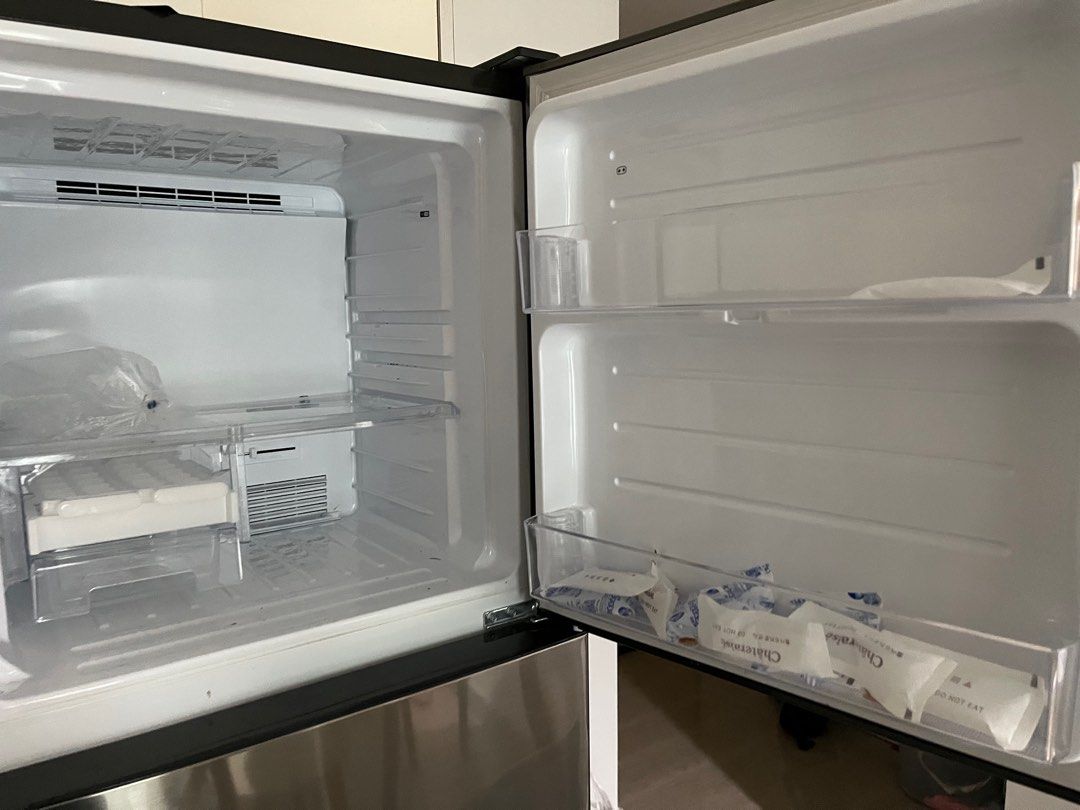Sharp refrigerator (Category: Refrigerators & Freezers) located in Singapore. Submitted by monotours (Listing ID 1357532130, Image 2). Description: Used for barely three years. Quite a lot of life left.