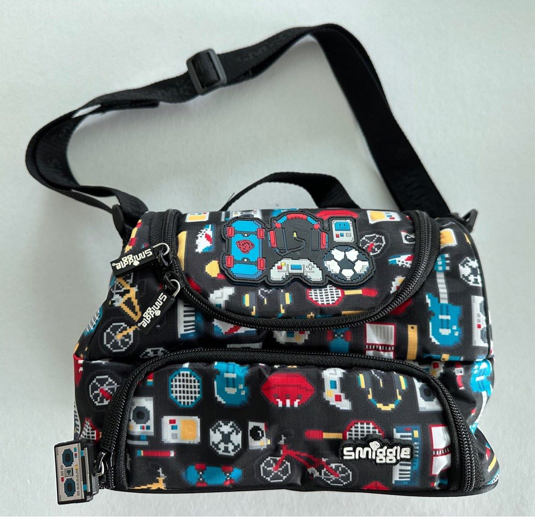 Smiggle Double Decker Lunch Bag w/ Strap (Category: Other Babies Going Out Needs) located in Manila. Submitted by monica515 (Listing ID 1357520405, Image 1). Description: Size: 6.5”h x 9”w x 6”d.