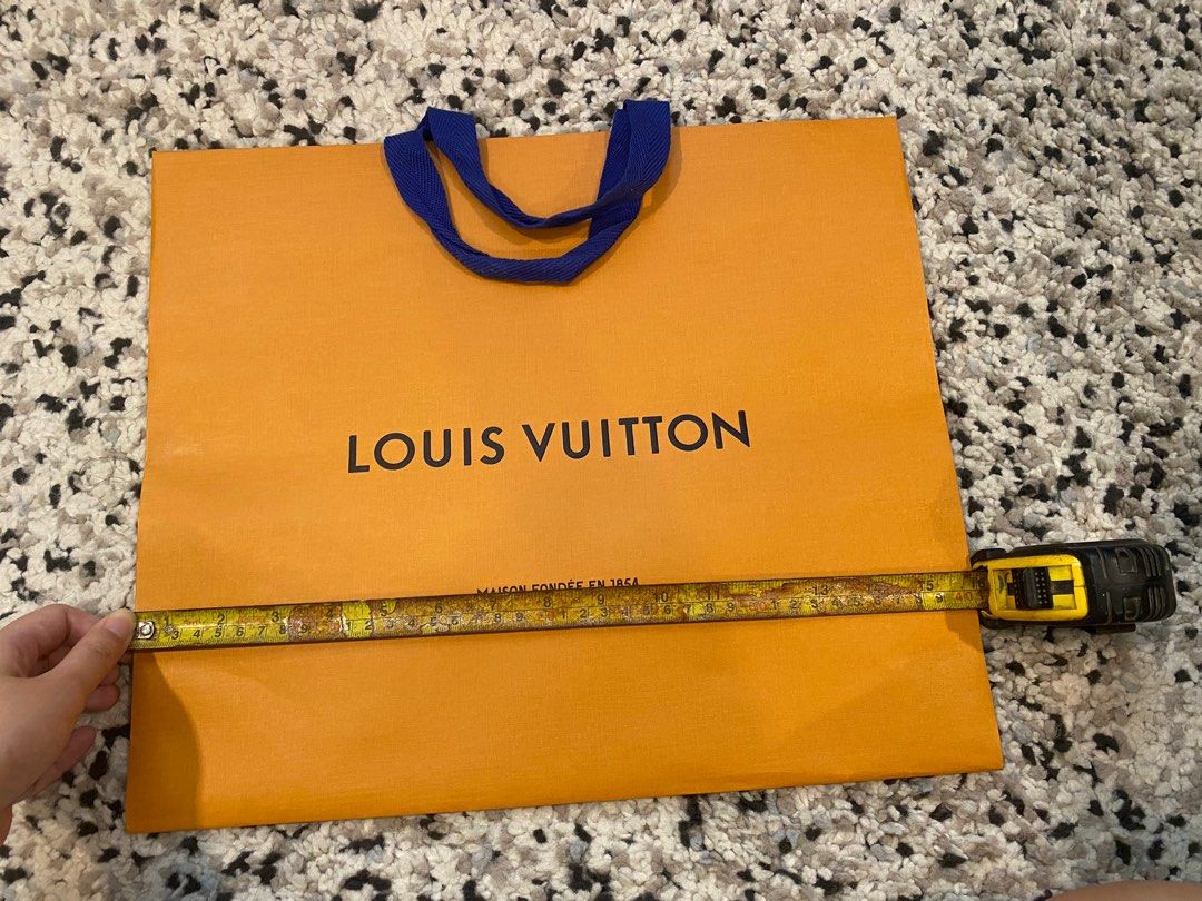 Authentic Louis Vuitton Paper Bag (Category: Luxury Bags & Wallets) located in Quezon City. Submitted by eleventwelveph (Listing ID 1357615455, Image 2). Description: Authentic Louis Vuitton Paper Bag actual photo posted with measurement .