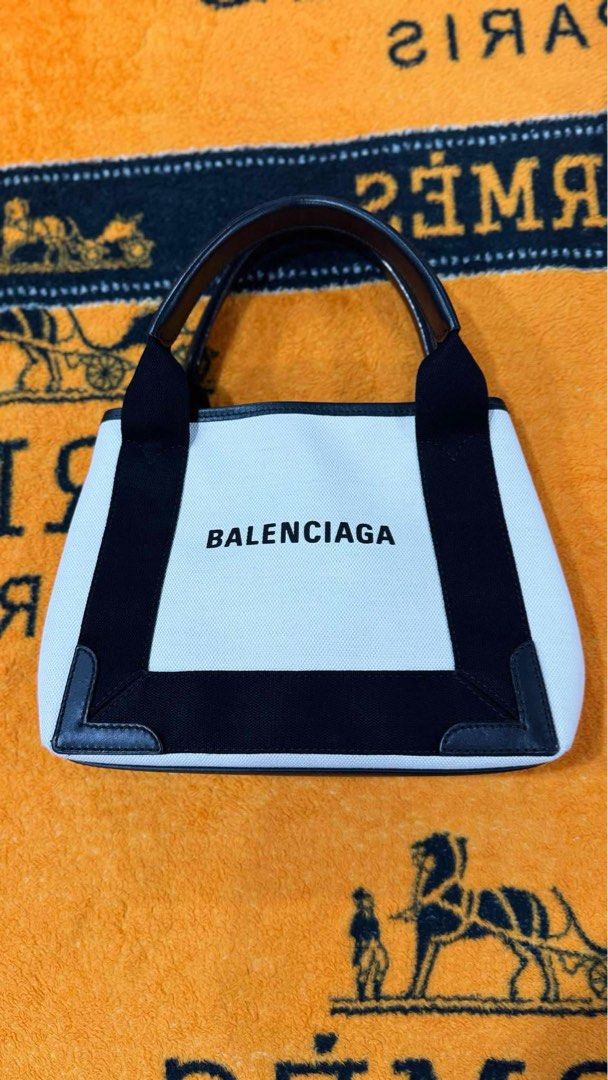 Authentic BALENCIAGA (Category: Luxury Bags & Wallets) located in Manila. Submitted by jey_ann014 (Listing ID 1357663900, Image 3). Description: FOR SALE❗️ Balenciaga Cabas Small Tote Bag Rank A Dust bag only Selling Price: 45,000 💯% Authentic with money back Guaranteed Disclaimer: We are not affiliated or officially connected to any of the brands featured in our page. All mentioned brand names are trademarks and copyrights belong to the origina