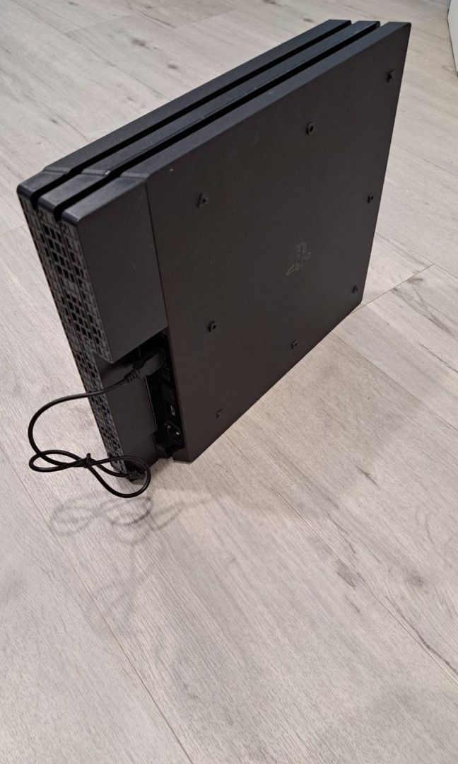 PS4 Pro (Category: PlayStation) located in Singapore. Submitted by dryxyz (Listing ID 1357675475, Image 2). Description: 1 TB PS4 pro with cooling fan attachment & lightly used controller.