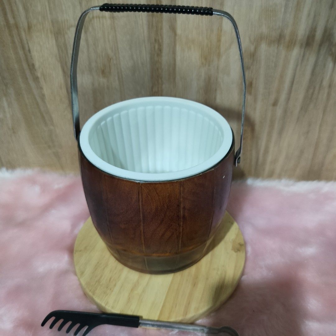 VINTAGE WOOD DESIGN ICE BUCKET (Category: Other Kitchenware & Tableware) located in Baao. Submitted by all.things.japan (Listing ID 1357711076, Image 3). Description: Vintage Faux Wood Ice Bucket Large Capacity Made of hard plastic material Comes with a tong Heavy duty Japan Surplus Dimensions: Diameter: 6.0 inches Height: 5.5 inches Price: P650.00 Add Sf DM for inquiries.