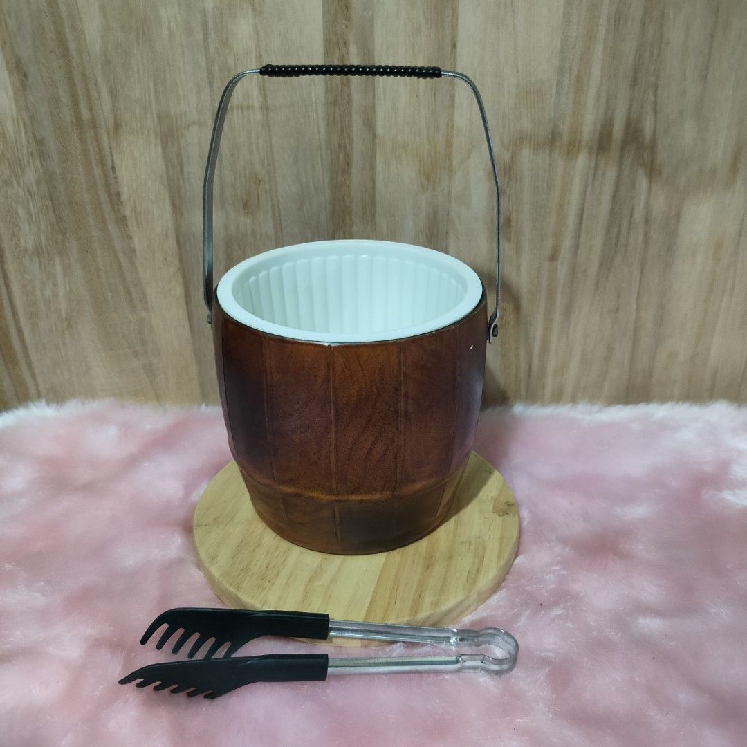 VINTAGE WOOD DESIGN ICE BUCKET (Category: Other Kitchenware & Tableware) located in Baao. Submitted by all.things.japan (Listing ID 1357711076, Image 1). Description: Vintage Faux Wood Ice Bucket Large Capacity Made of hard plastic material Comes with a tong Heavy duty Japan Surplus Dimensions: Diameter: 6.0 inches Height: 5.5 inches Price: P650.00 Add Sf DM for inquiries.