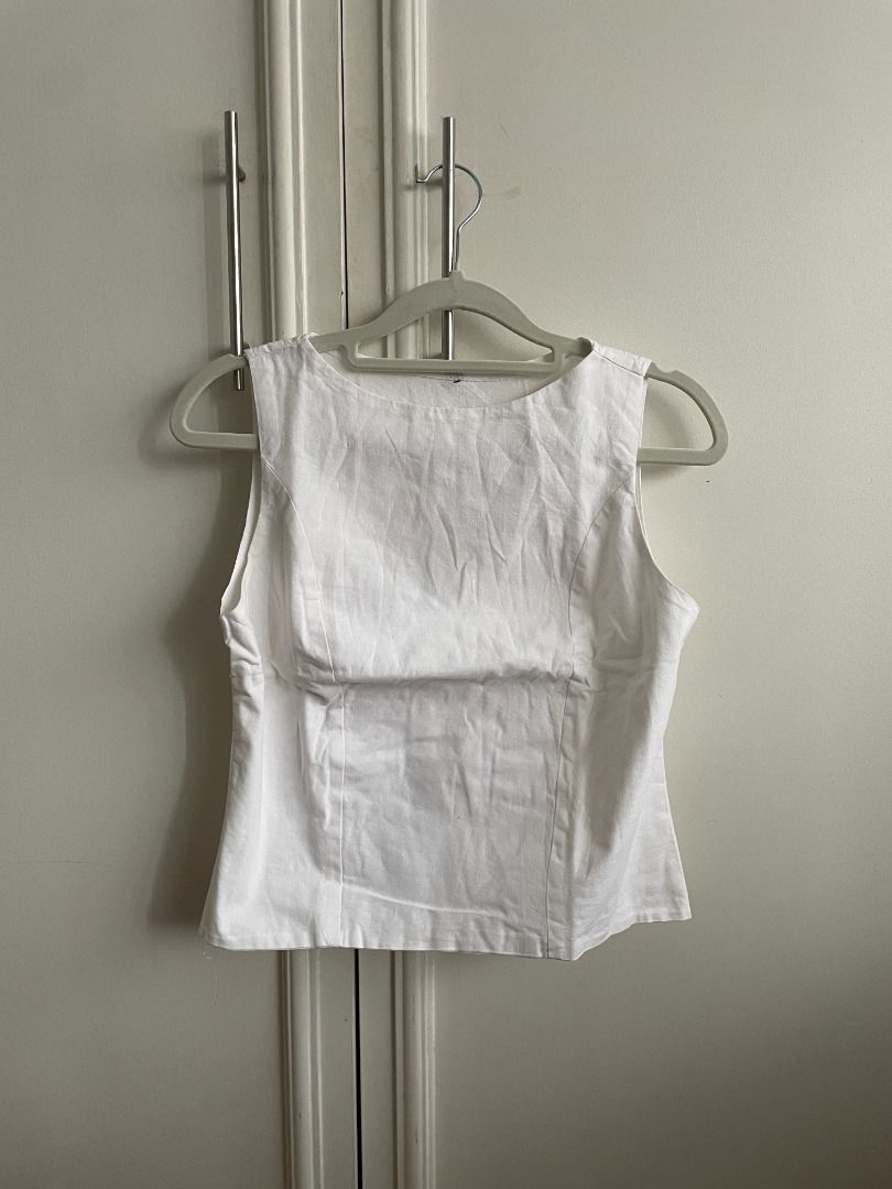 women's white sleeveless backless top (Category: Sleeveless) located in Quezon City. Submitted by shopesr (Listing ID 1357653244, Image 1). Description: size: XS dimensions: 15 in (w) 18 in (l) material: linen issues: no issues, never used.