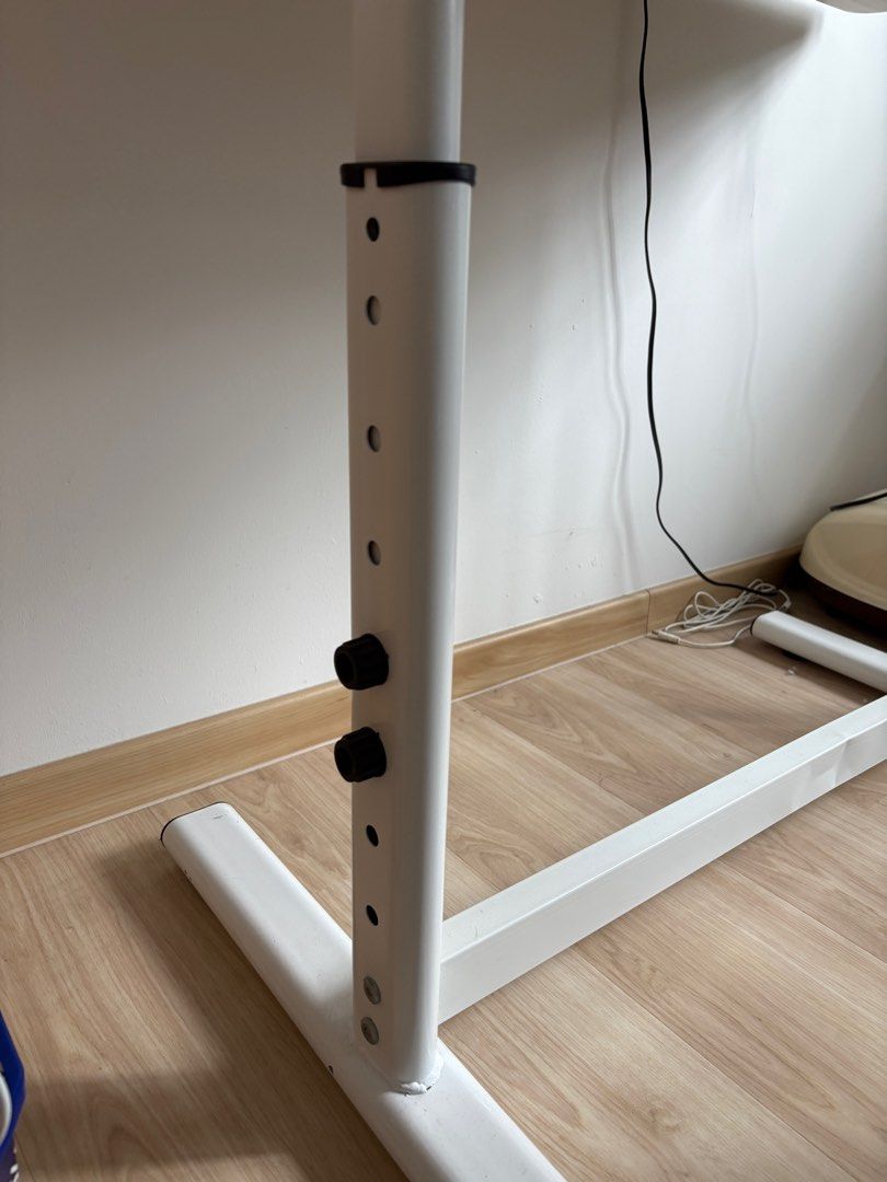 Adjustable study table (Category: Tables & Sets) located in Singapore. Submitted by shermtf (Listing ID 1357830927, Image 3). Description: Wooden table with adjustable legs. The leg part is slightly bent (during delivery). Dimensions: 100 cm (Length) x 70 cm (width), 75 cm (height) .