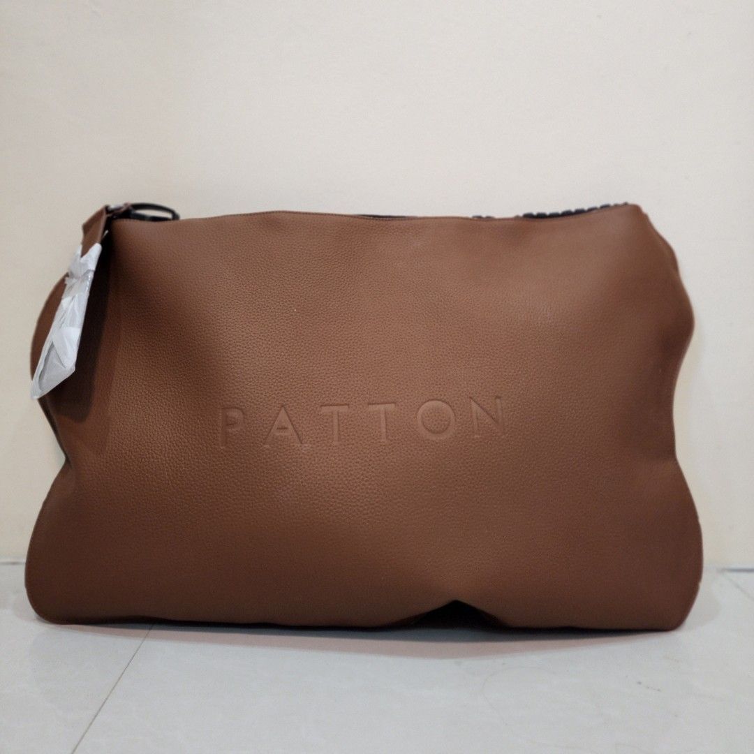 Patton Giant Brown Envelop Leather Bag (Category: Luxury Bags & Wallets) located in Manila. Submitted by lachinitasph_ (Listing ID 1357851481, Image 3). Description: this is genuine leather so expect that it is heavy and thick bnew but has some edge scuffings due to storage but barely noticeable.