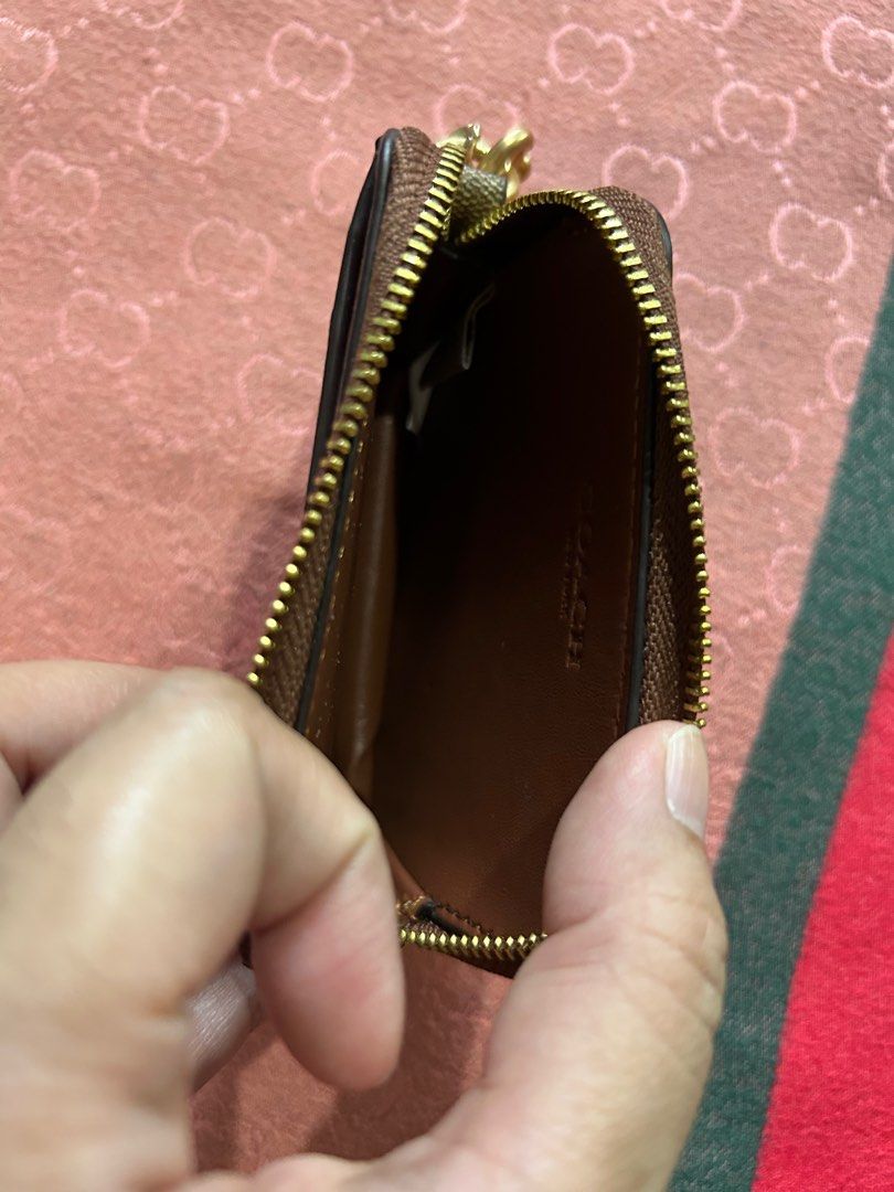 Coach Zip Card Case (Category: Luxury Bags & Wallets) located in Pasay City. Submitted by jhokz5683 (Listing ID 1358052904, Image 3). Description: Coach Zip Card Case Color: Signature Brown Not OG Made from Vietnam .