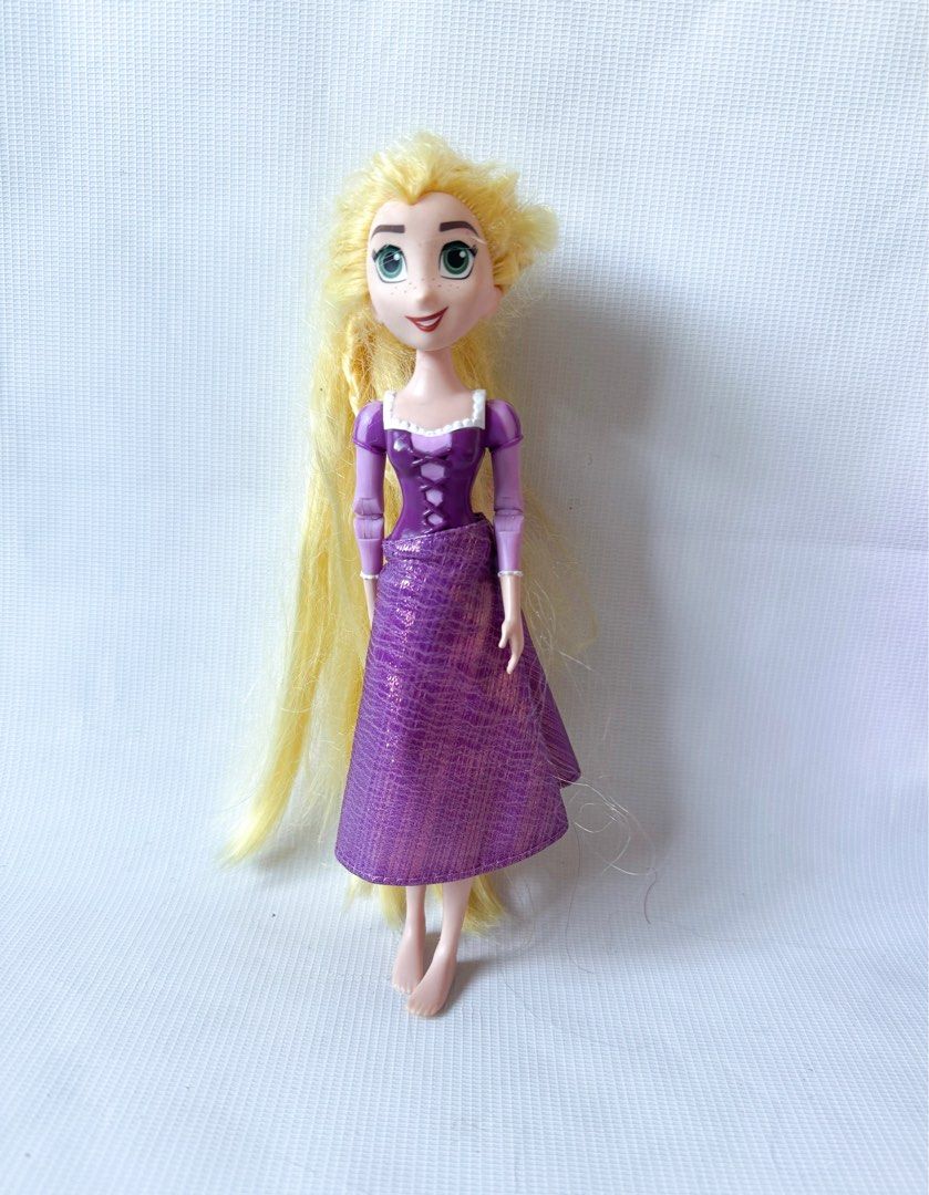 Disney Tangled the Series Rapunzel Doll (Category: Figurines & Statues) located in Cainta. Submitted by mly_d (Listing ID 1357990761, Image 1). Description: Disney Tangled the Series Rapunzel Doll ₱350 • This doll is based on the character Rapunzel from Disney’s animated movie Tangled and the series Rapunzel’s Tangled Adventure. • The doll is articulated and has long, blonde hair, with a bendable braid for styling. • It is approximately 8 inches 