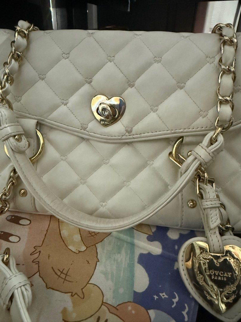 Lovcat Y2k OffWhite Quilted Hand Bag (Category: Luxury Bags & Wallets) located in Manila. Submitted by dreamland.mnl (Listing ID 1358026365, Image 3). Description: Still in good condition Heat tint on lock .