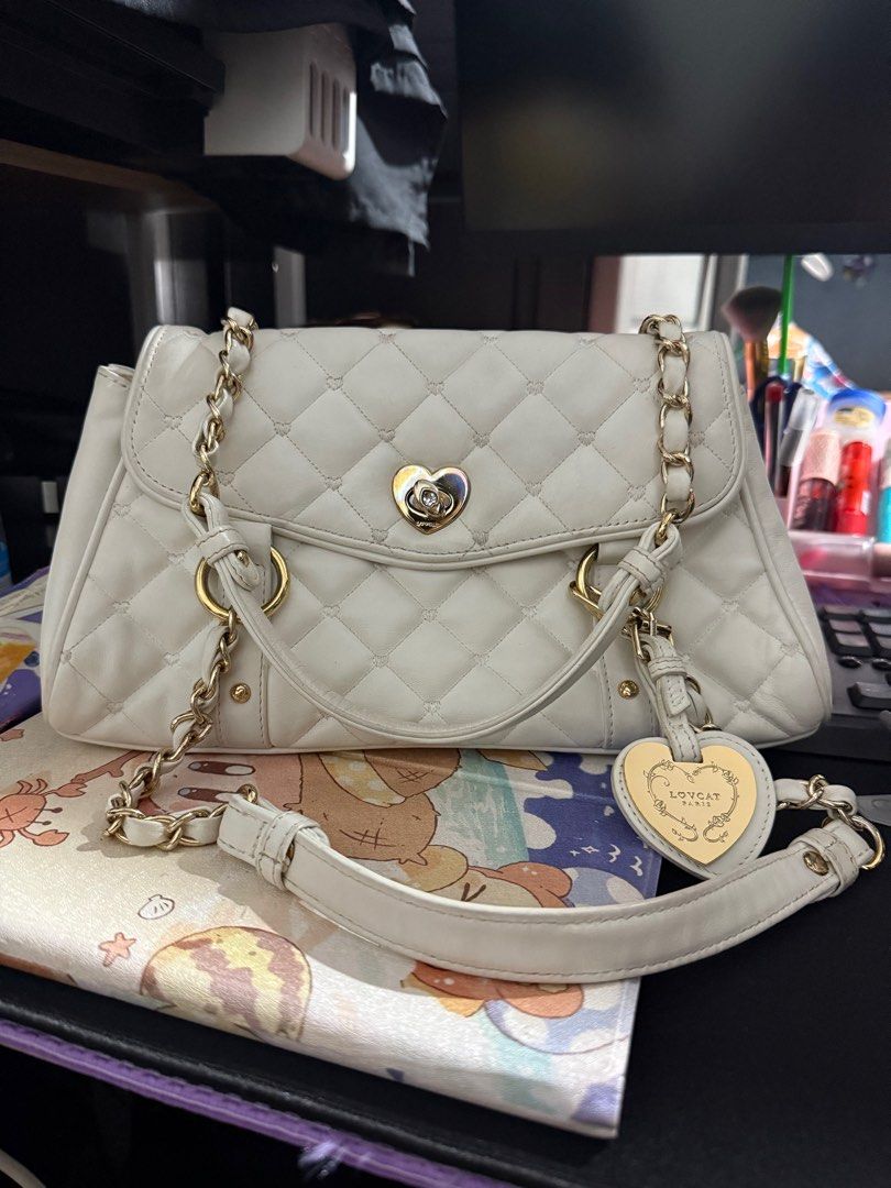 Lovcat Y2k OffWhite Quilted Hand Bag (Category: Luxury Bags & Wallets) located in Manila. Submitted by dreamland.mnl (Listing ID 1358026365, Image 1). Description: Still in good condition Heat tint on lock .