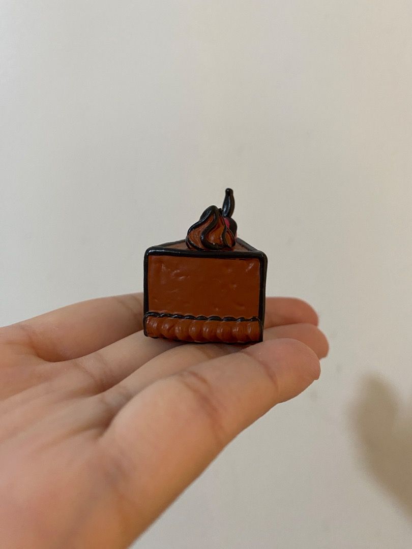 Mini Chocolate Cake Toy Trinket (from Gacha Machine) (Category: Kids Toys) located in Paranaque City. Submitted by patricia_1998 (Listing ID 1358023631, Image 2). Description: Mini Chocolate Cake Toy Trinket (from Gacha Machine) - used as display - got from a gacha machine Grab / Lalamove delivery (shouldered by buyer).