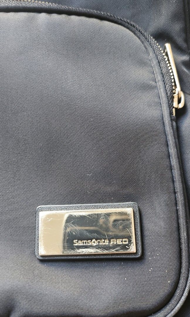 Samsonite Red Nylon Backpack (Category: Laptop Bags & Sleeves) located in Quezon City. Submitted by 88jellyfish88 (Listing ID 1357972277, Image 3). Description: Purchased for about PHP 9,000.00 in Changi airport last November 2023. Been one of my everyday bags hence the scratches on hardware. But still in really good condition. 💶 Gcash/bank transfer 📍QC 🚚 Grab/Lalamove.